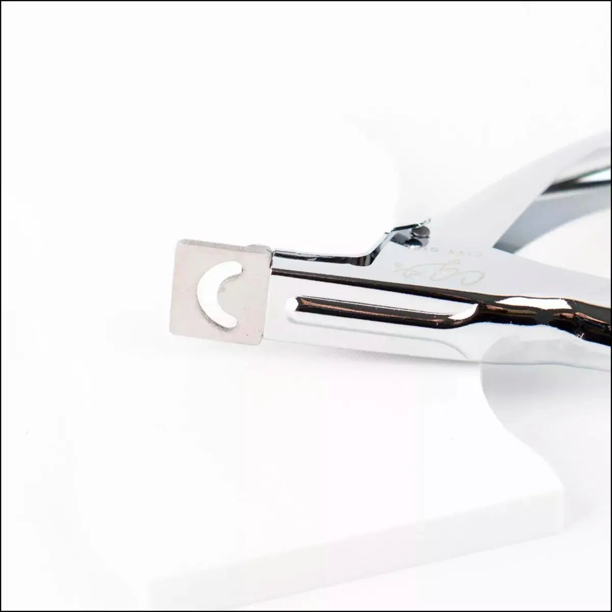 Corta tips metálico plateado Reestok